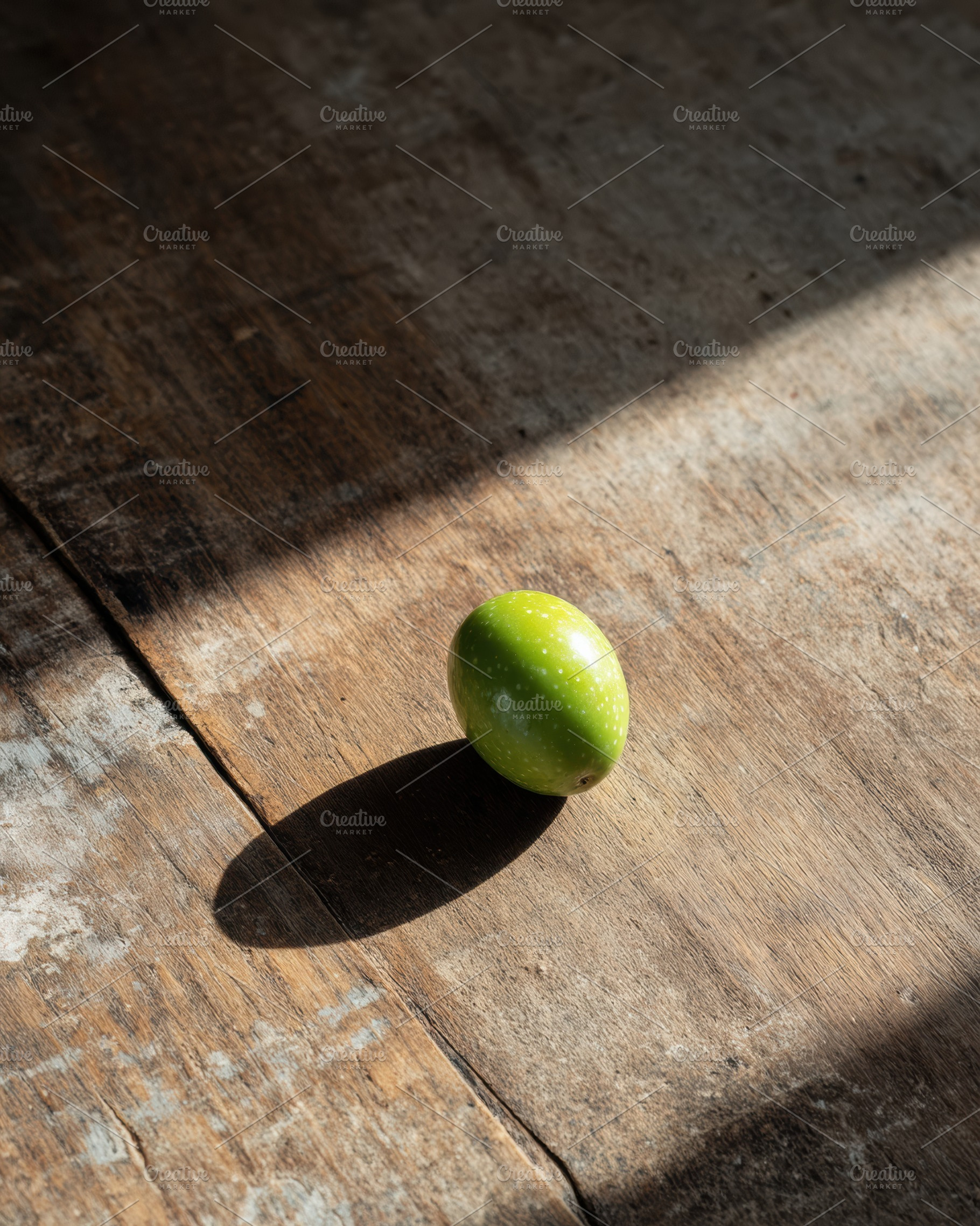 Single Olive on Aged Wooden Table, a Food & Drink Photo by Virgo Studio