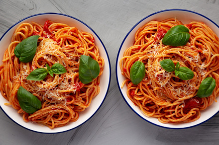 Homemade Pasta Pomodoro on Plates, top view. Flat lay, overhead,, a Food & Drink Photo by LiudmylaChuhunova