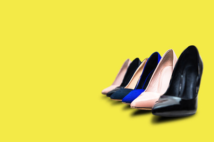 High heels footwear on a yellow