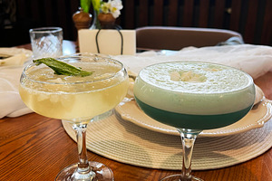 Elegant cocktails served in glasses on a wooden table with decorative elements, a Photo by AS photostudio