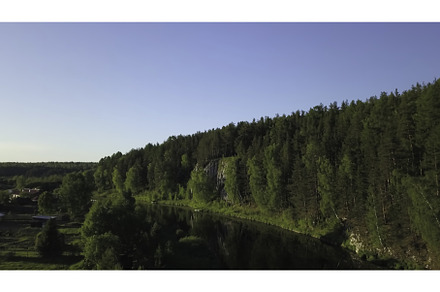 A Serene River Flowing Through a, a Nature Photo by Media Whale Stock