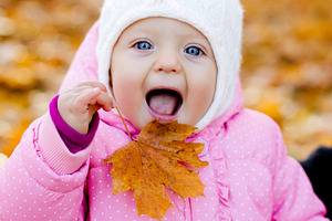 Happy playful child outdoors containing autumn, fall, and child