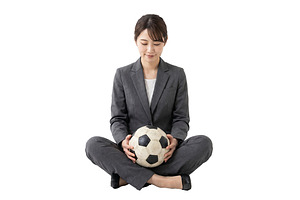 businesswoman holding a soccer ball, a Person Photo by itakdalee