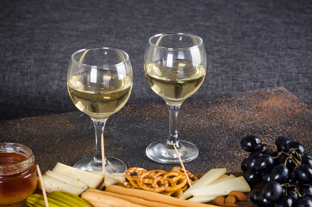 Cheese plates served with grapes, jam, snacks, crackers and nuts, a Food & Drink Photo by vimart