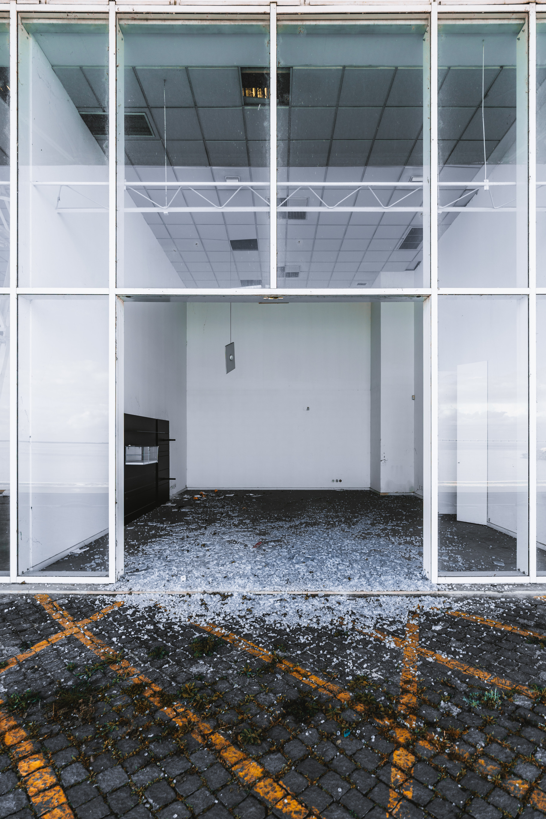 Broken glass in abandoned building, an Architecture Photo by SkyNext