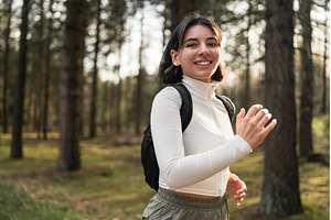 Woman in white sportswear with a, a Nature Photo by AD Stock Images