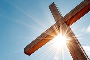 Sunlit wooden cross against a clear, a Holiday Photo by MistyDay