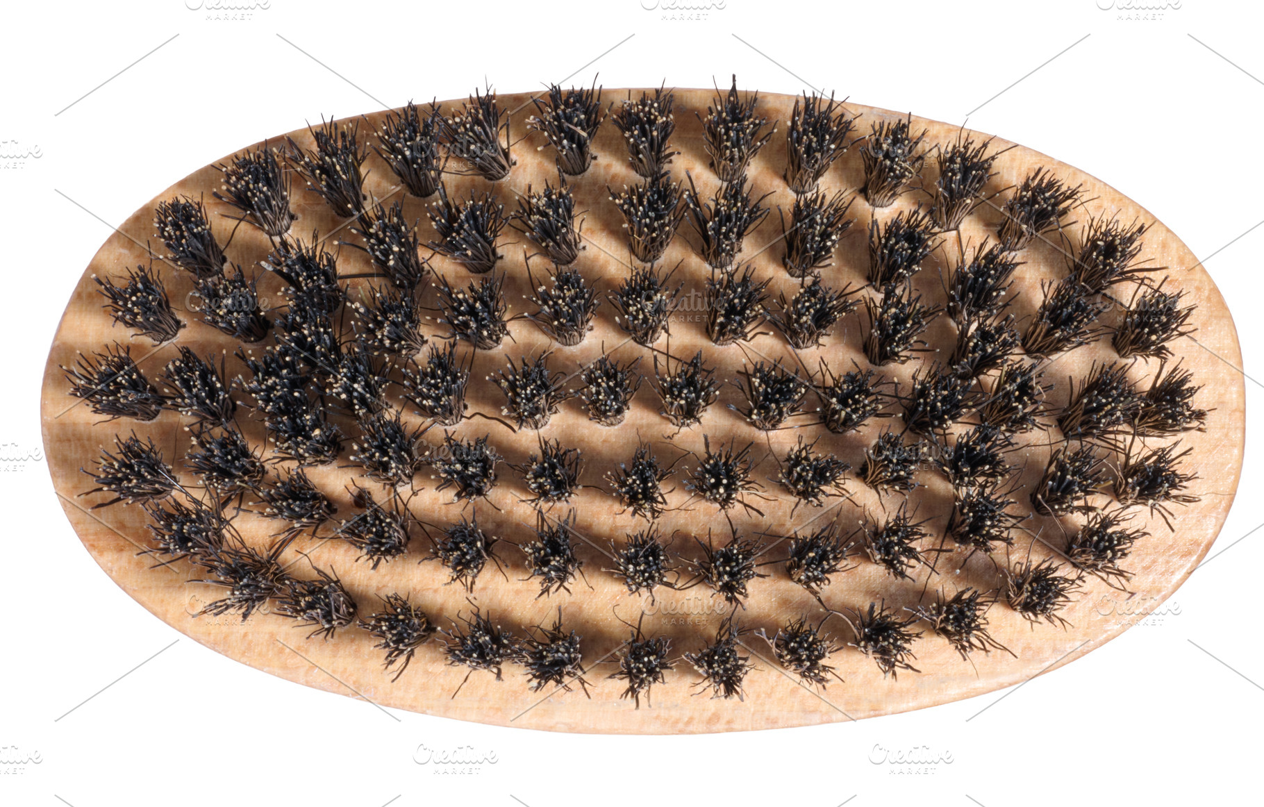 Wooden brush with dense natural black bristles, oval shape. Isol, a Beauty & Fashion Photo by ndanko