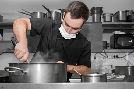 Chef stirring sauce in stainless steel pot, close-up. Professional kitchen, res, a Person Photo by david.herraez.calzad