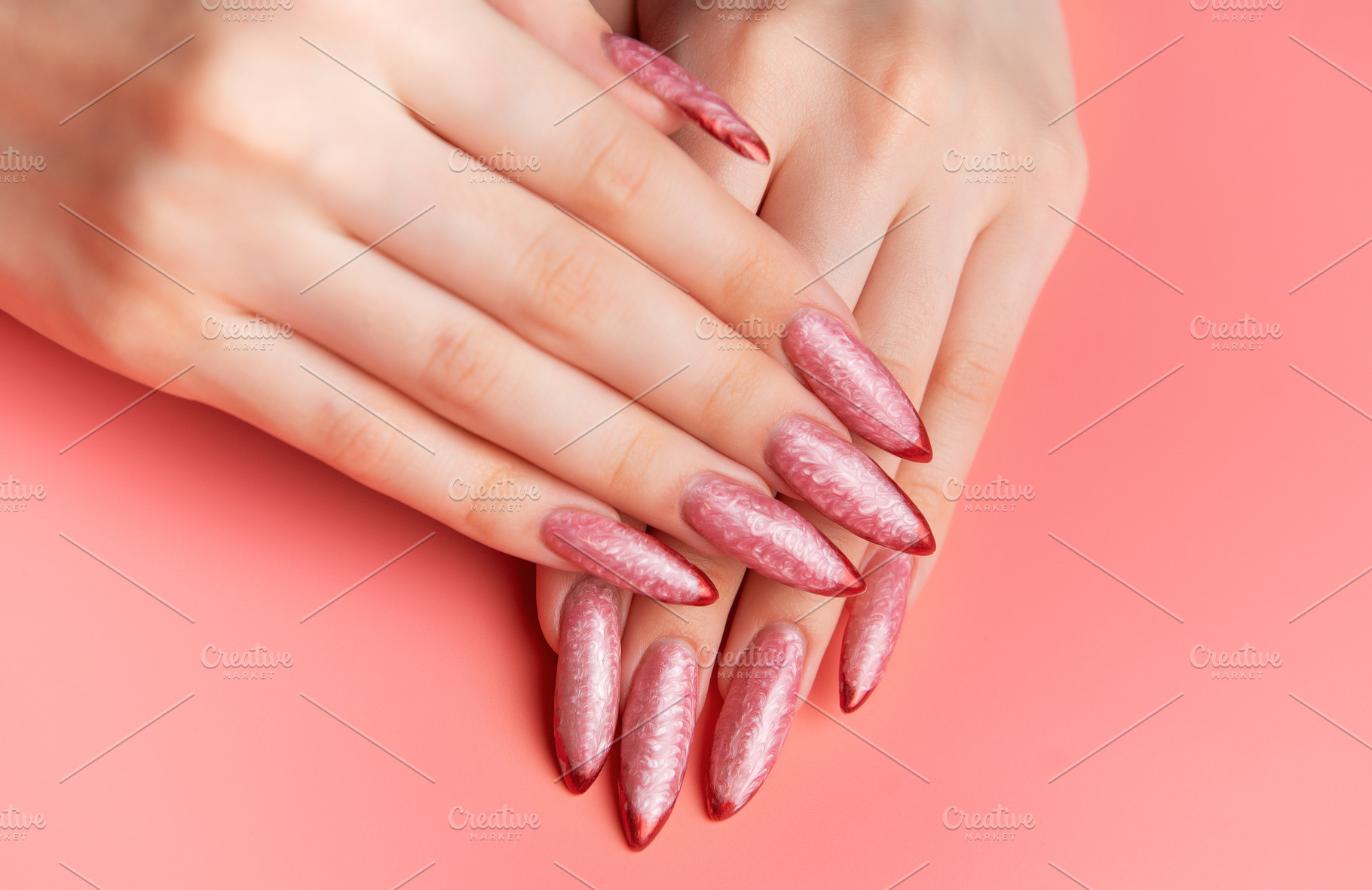Woman showing stiletto pink and red ombre nails, a Beauty & Fashion Photo by Olena Rudo