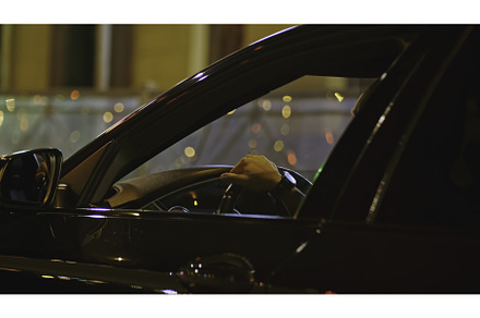 Man's hand behind wheel of car. Clip, a Transportation Photo by Media Whale Stock