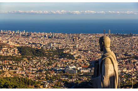 Sculpture of apostle and view of barcelona stock photo containing barcelona, an Architecture Photo by Leonid Andronov