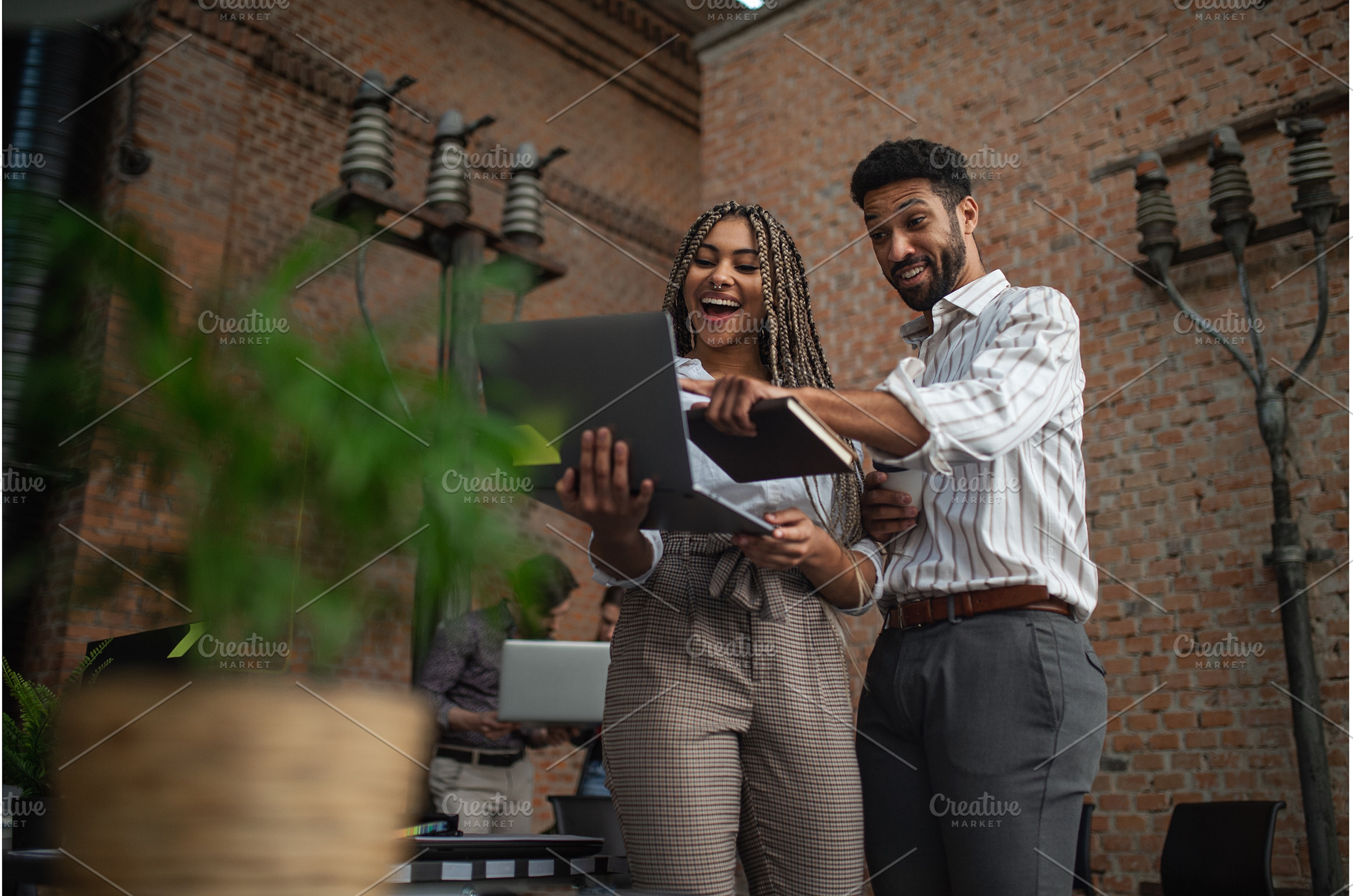 Cheerful young businesspeople with, a Person Photo by HalfPoint