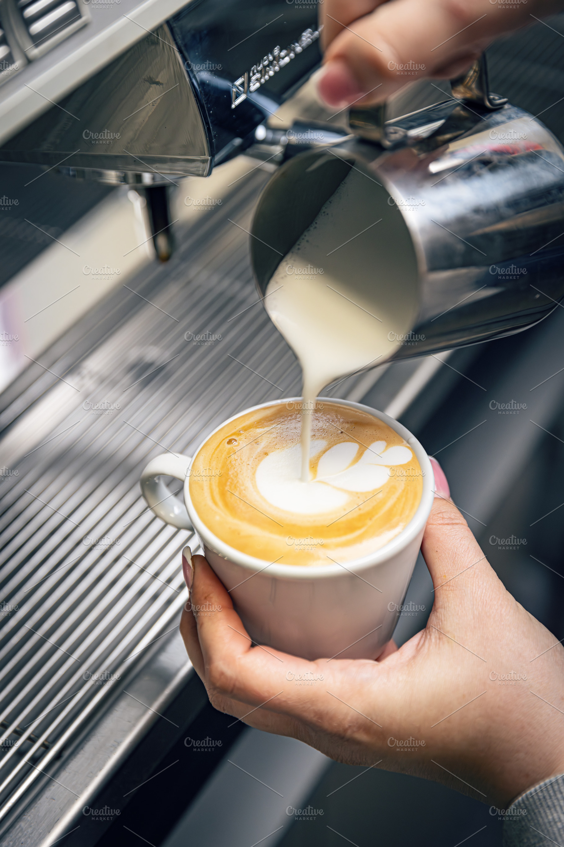 Barista preparing a cappuccino, a Photo by Grafvision photography