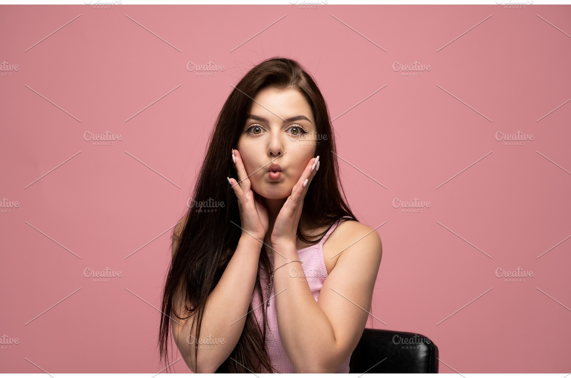 Young woman puckering lips and, a Person Photo by volodymyrshtun13795