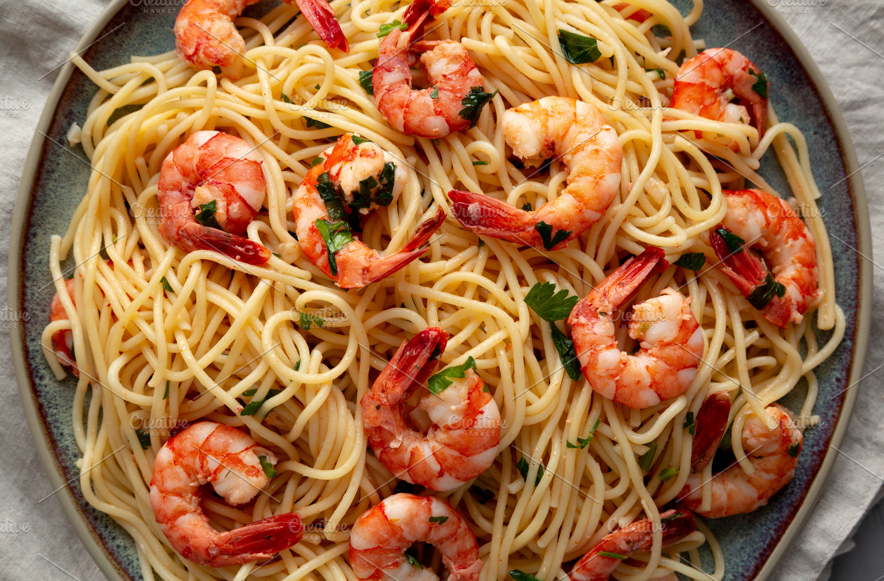 Homemade Cooked Garlic Shrimp Scampi on a Plate, top view. Flat, a Food & Drink Photo by LiudmylaChuhunova
