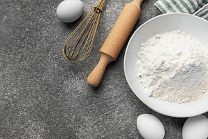 Baking ingredients on kitchen counter preparing pastry, a Food & Drink Photo by Olena Rudo
