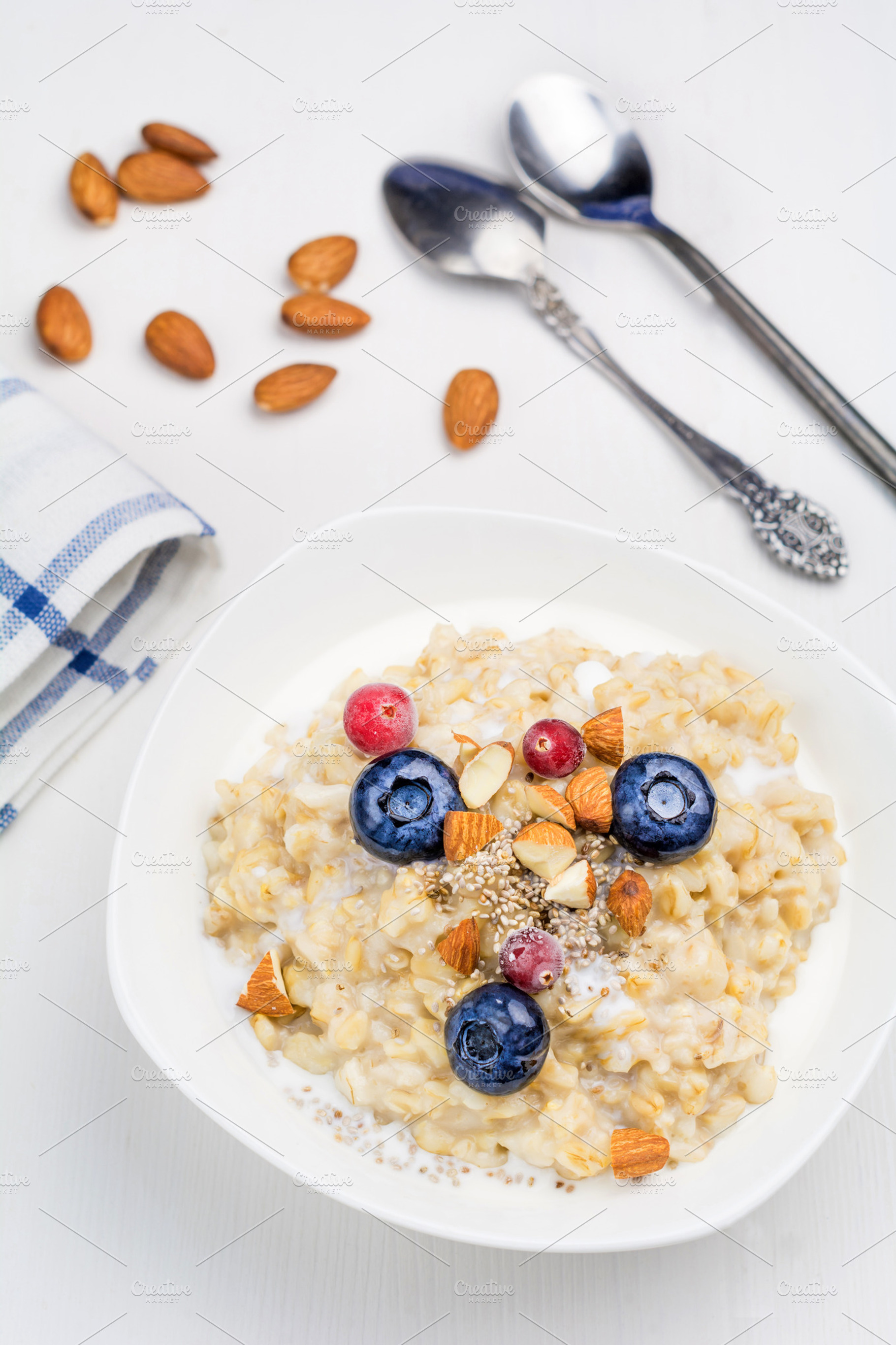 Oatmeal porridge with berries containing milk, breakfast, and oat, a Food & Drink Photo by The baking man
