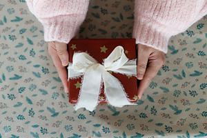 Merry Christmas and Happy Holidays! Hands holding stylish christ, a Holiday Photo by Sonjachni