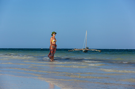 Girl walks on the beach, a Person Photo by Photostock