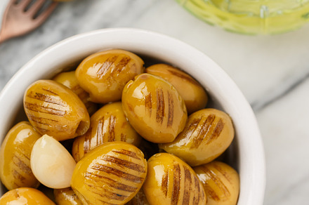 Grilled green olives