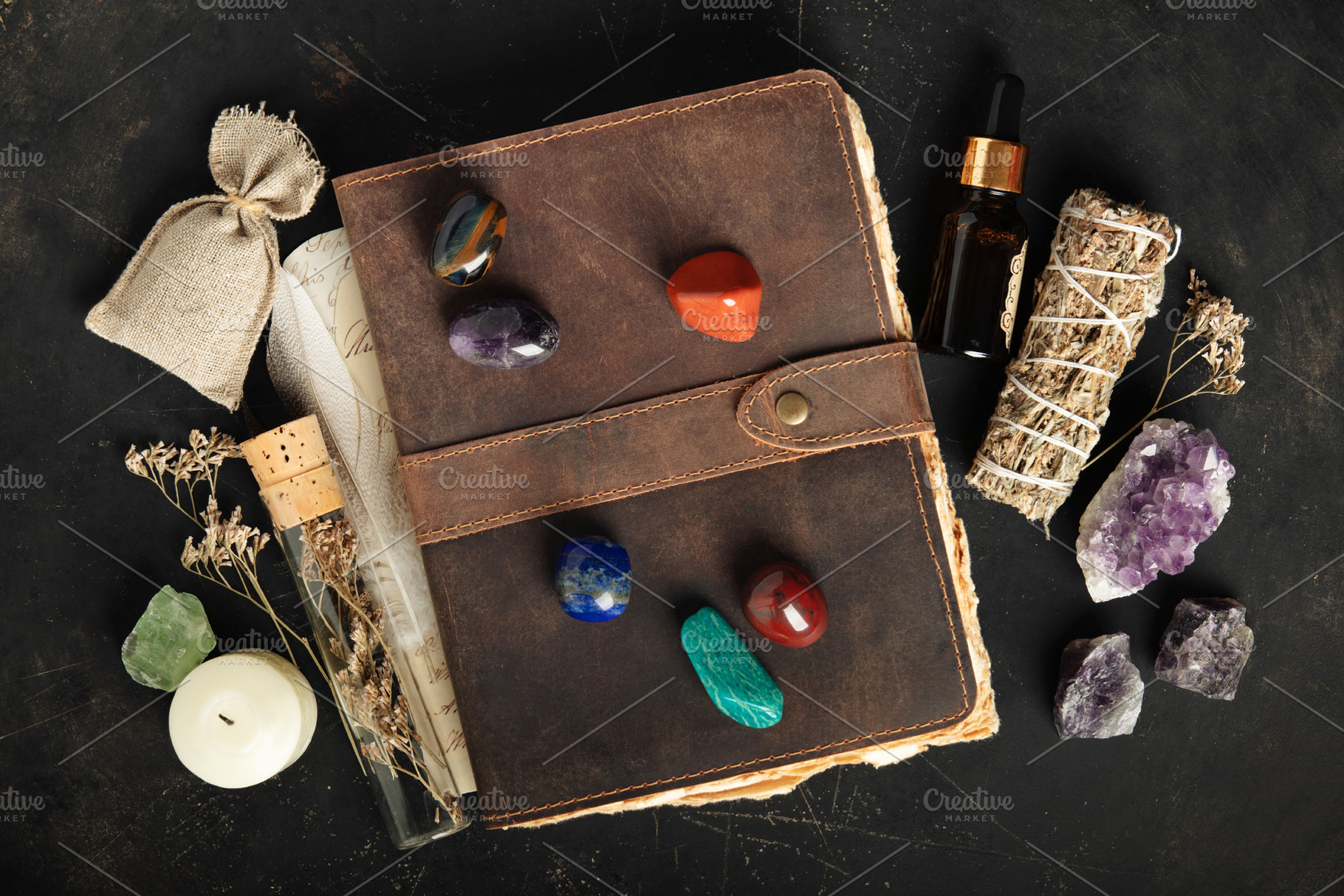 Rustic Leather Journal with Healing Crystals on Dark Background, an Arts & Entertainment Photo by Natalia Klenova's Shop