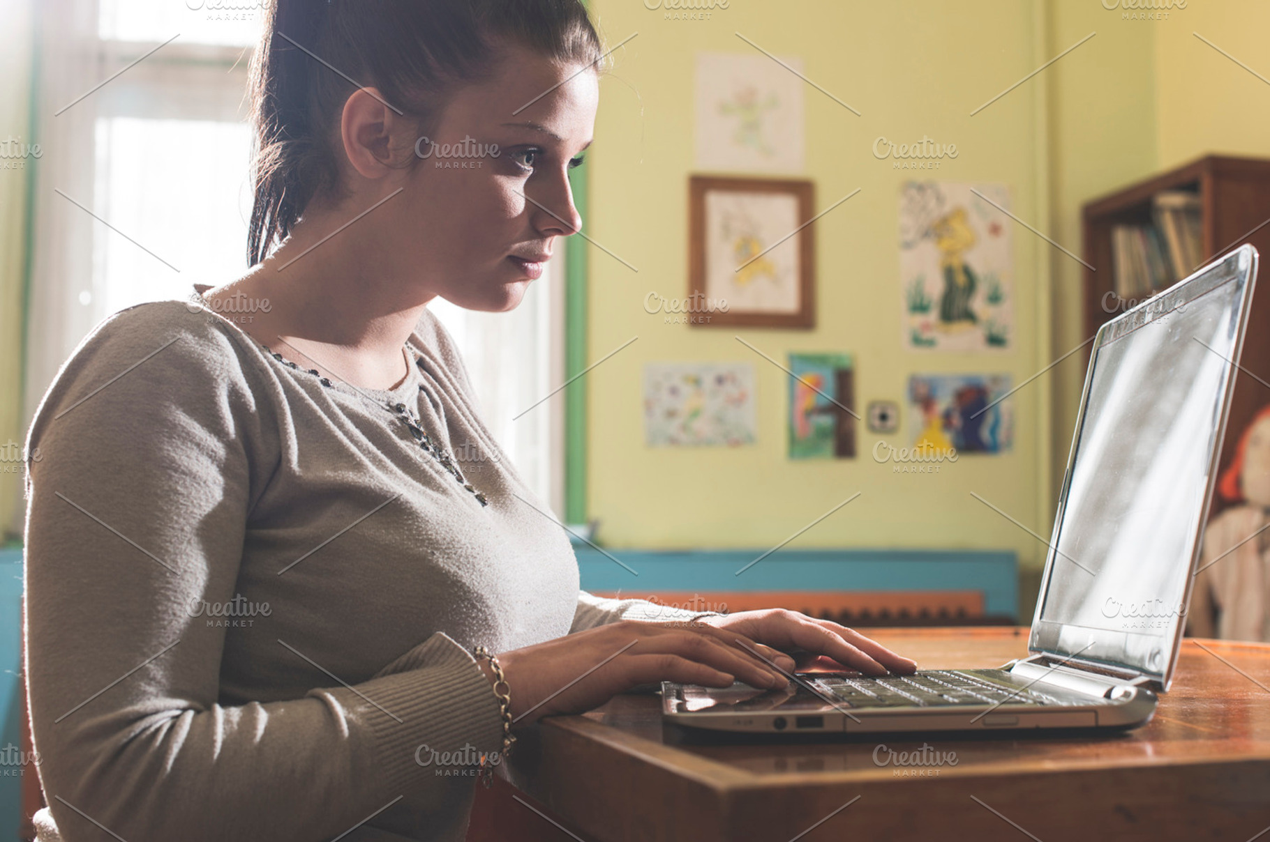 Student girl and laptop in a library stock photo containing laptop and library, a School & Education Photo by Deyan Georgiev