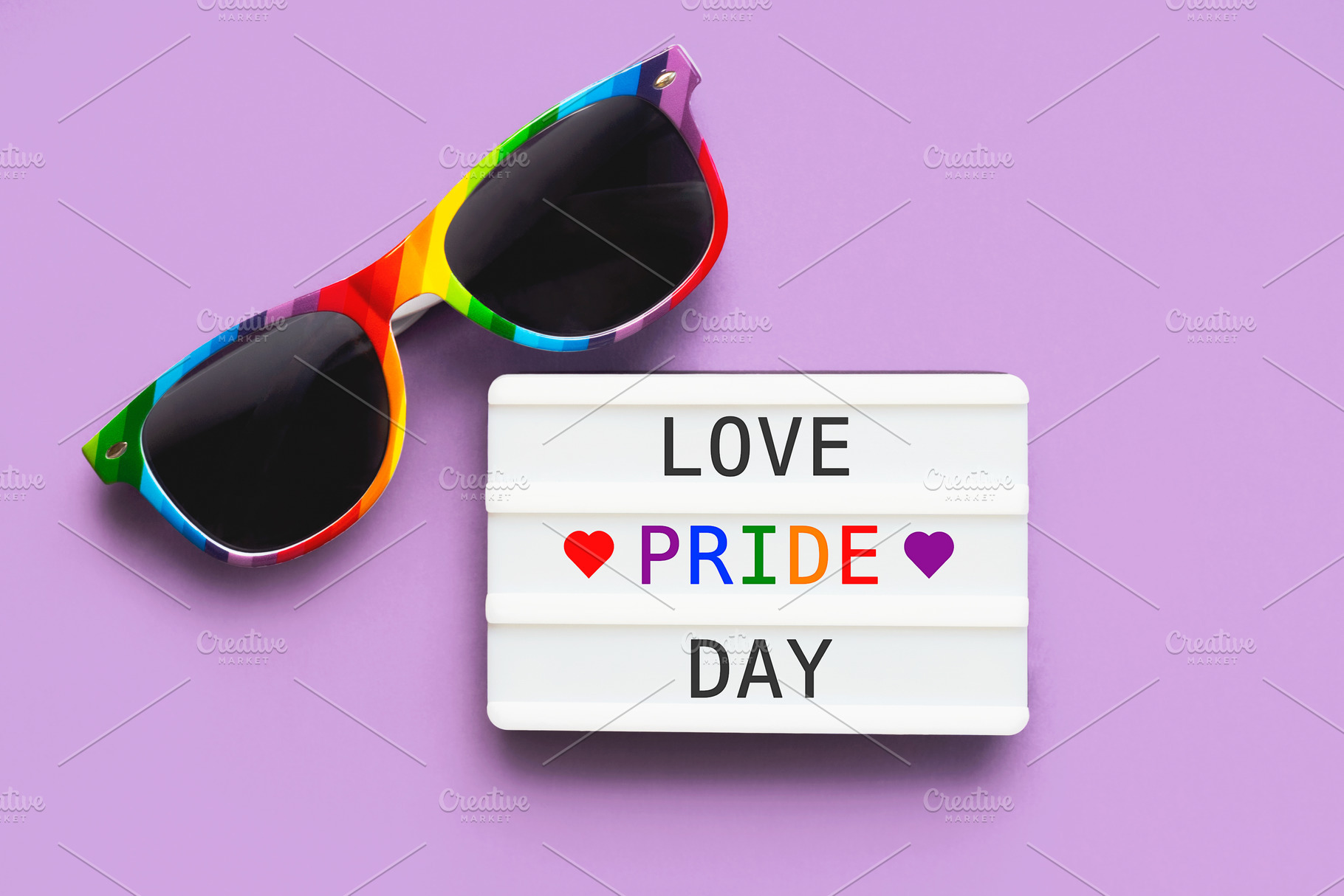 Closeup of LGTBI flag sunglasses and, a Holiday Photo by esthermm