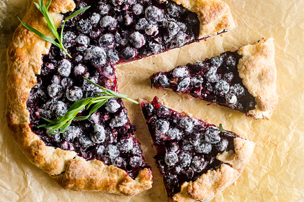 Homemade blackcurrant galette on old concrete background., a Food & Drink Photo by vimart