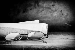 Old Glasses on Desk, a School & Education Photo by THP Creative