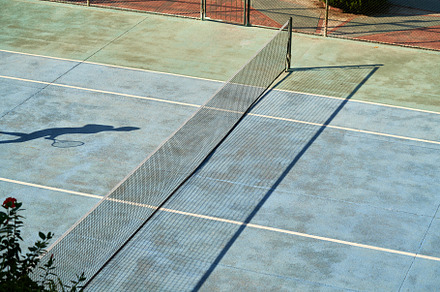 Tennis playground with a shadow of a player, a Sports & Recreation Photo by Madeleine Steinbach