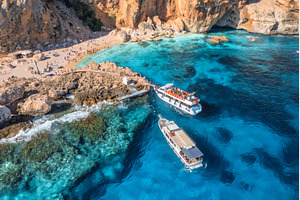 Aerial view of yacht and sandy beach, a Nature Photo by den-belitsky