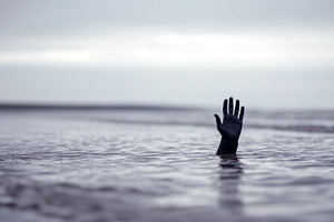 A single hand in a black glove reach, a Person Photo by MistyDay