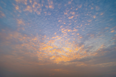 Sunset sky. Abstract nature background. Dramatic blue with orang, a Background Photo by Tampatra