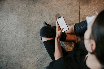 creative woman working on iphone