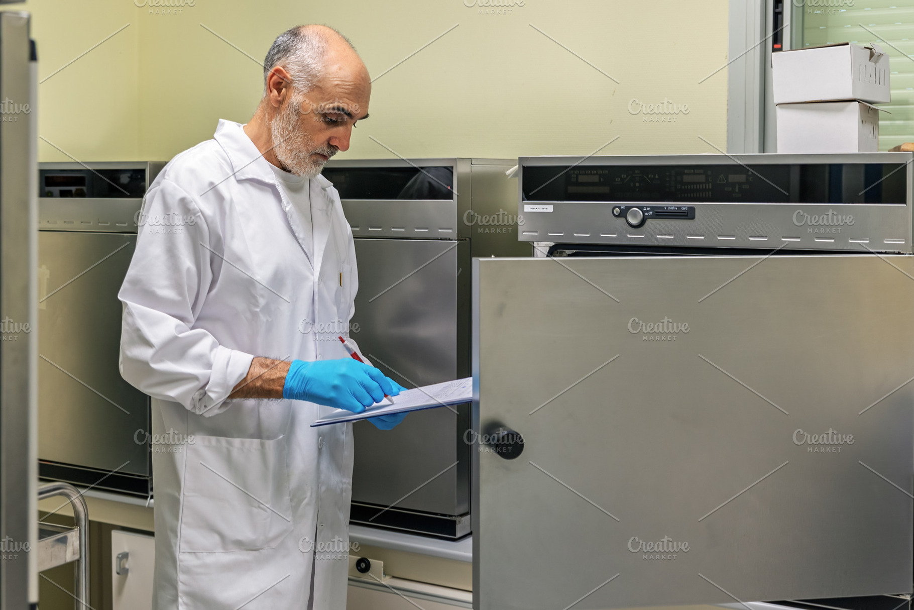 Laboratory technician recording data, a Health & Medical Photo by Perpis