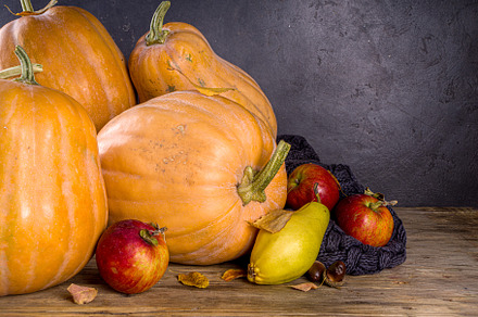Autumn pumpkins on wooden autumn background, a Food & Drink Photo by Rimma