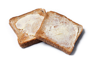 Sliced fresh bread and butter isolated on white background, a Food & Drink Photo by etorres69