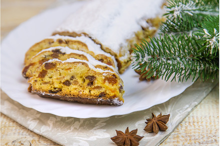 Stollen Christmas cake on the table, a Holiday Photo by yanadjana
