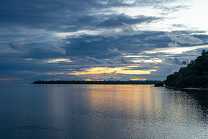 Sunset over the tranquil lagoon of Maupiti, French Polynesia, a Nature Photo by GoodGoods