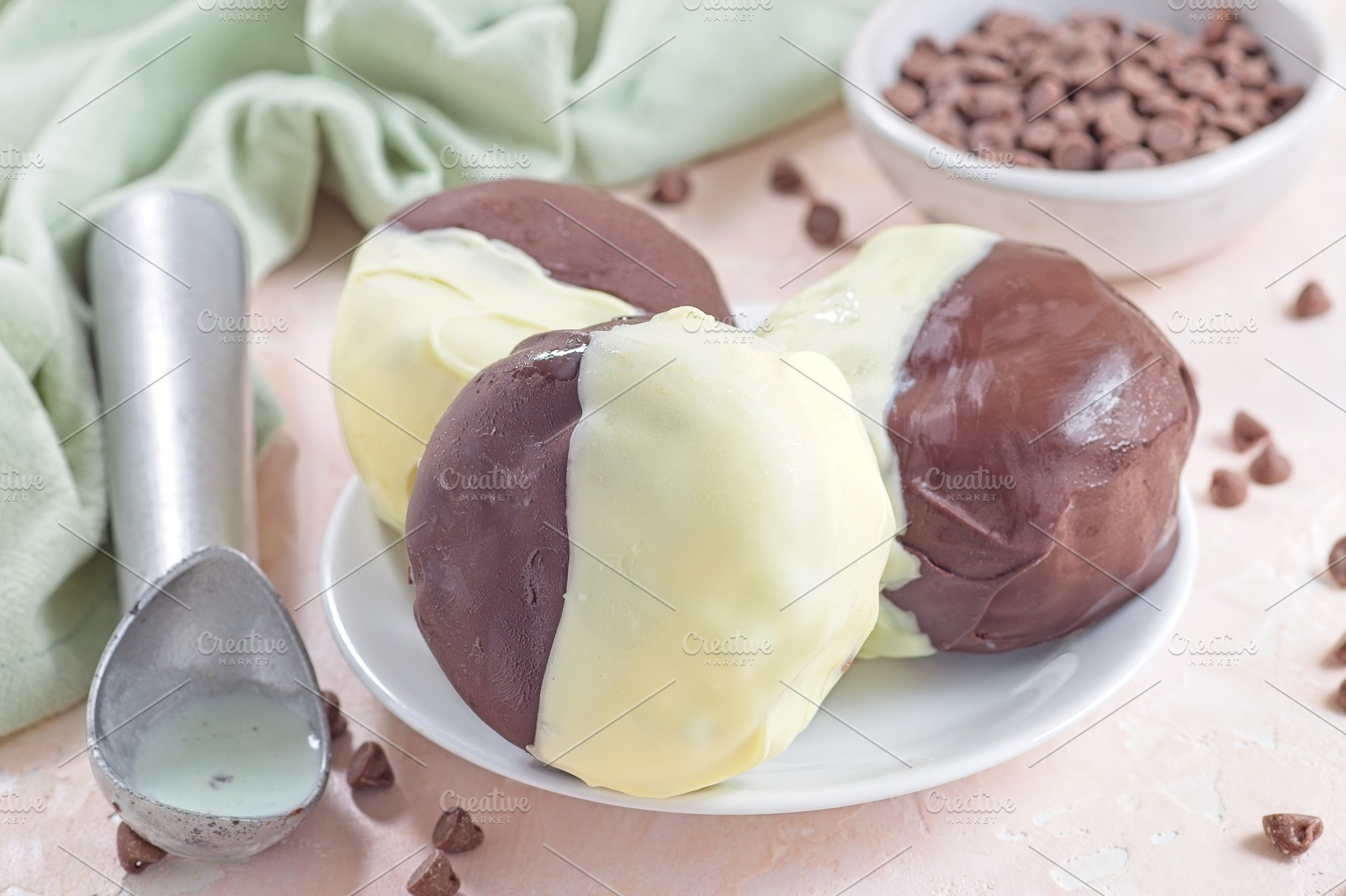 Dark and white chocolate covered ice cream sandwiches, on white plate, horizont, a Food & Drink Photo by iuliia_n