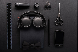 Flat lay of black stationery, a Background Photo by Stockphoto by vzwer