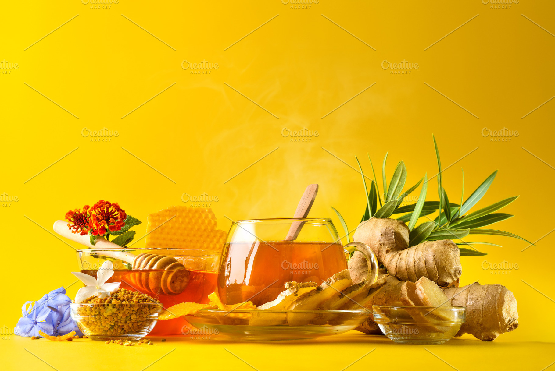 Glass cup with ginger and honey infusion yellow isolated backgro, a Photo by Davizro's Market