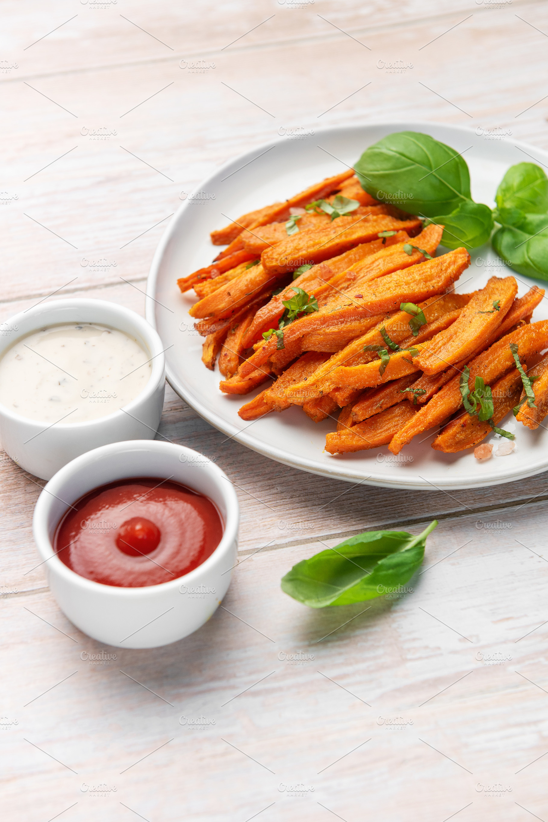Sweet potato fries with ketchup and ranch sauces, a Food & Drink Photo by Olena Rudo