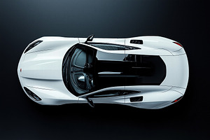 Top view of a sleek white sports car with aerodynamic design and black accents., an Object Graphic by Textures & Backgrounds