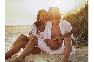 Couple in Love Playing Guitar and