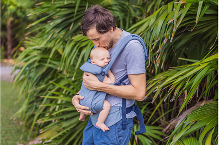 Young father walks in nature with