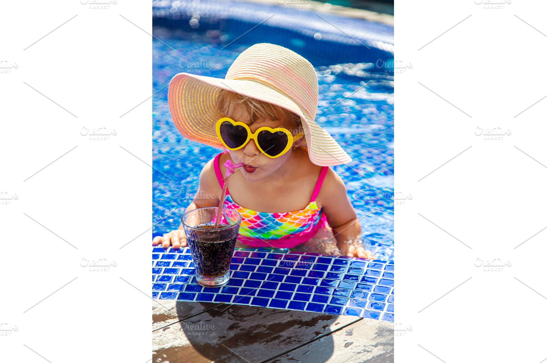 A child near the pool in sunglasses, a Person Photo by yanadjana
