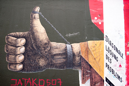 Berlin wall art  thumbs up stock photo containing berlin wall and east side