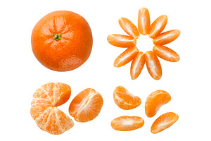 Set of tangerines and peeled slices, a Food & Drink Photo by innakreativ